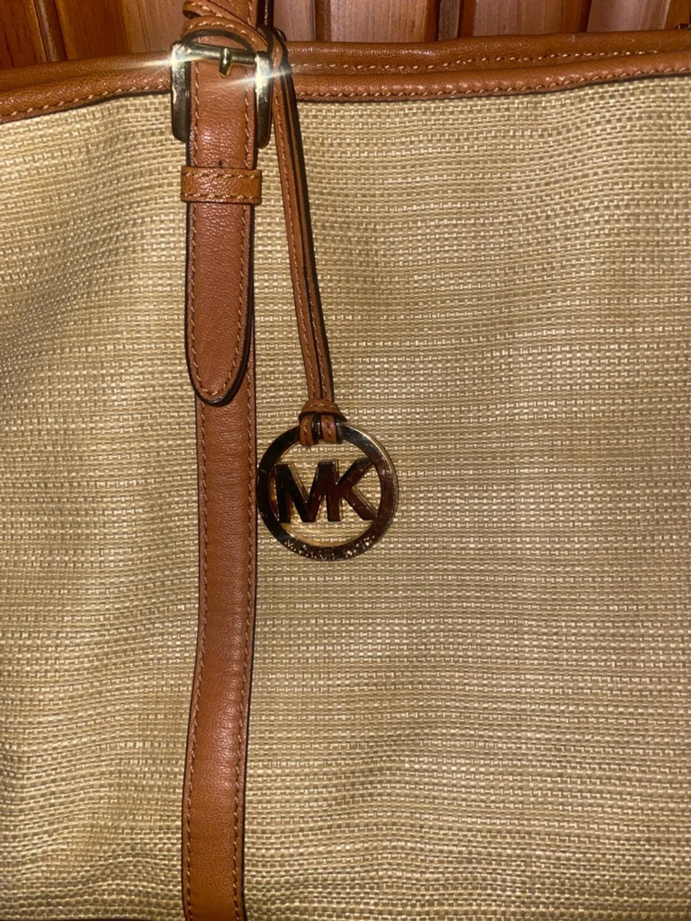 Michael Kors Raffia Tote with Tan Leather Trim and handles.